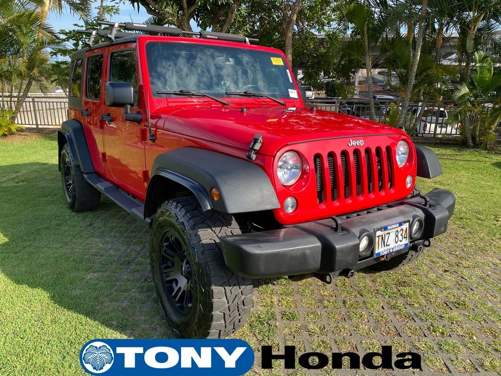 2015 Jeep Wrangler Unlimited Sport in Firecracker Red Clear Coat — front three-quarter view