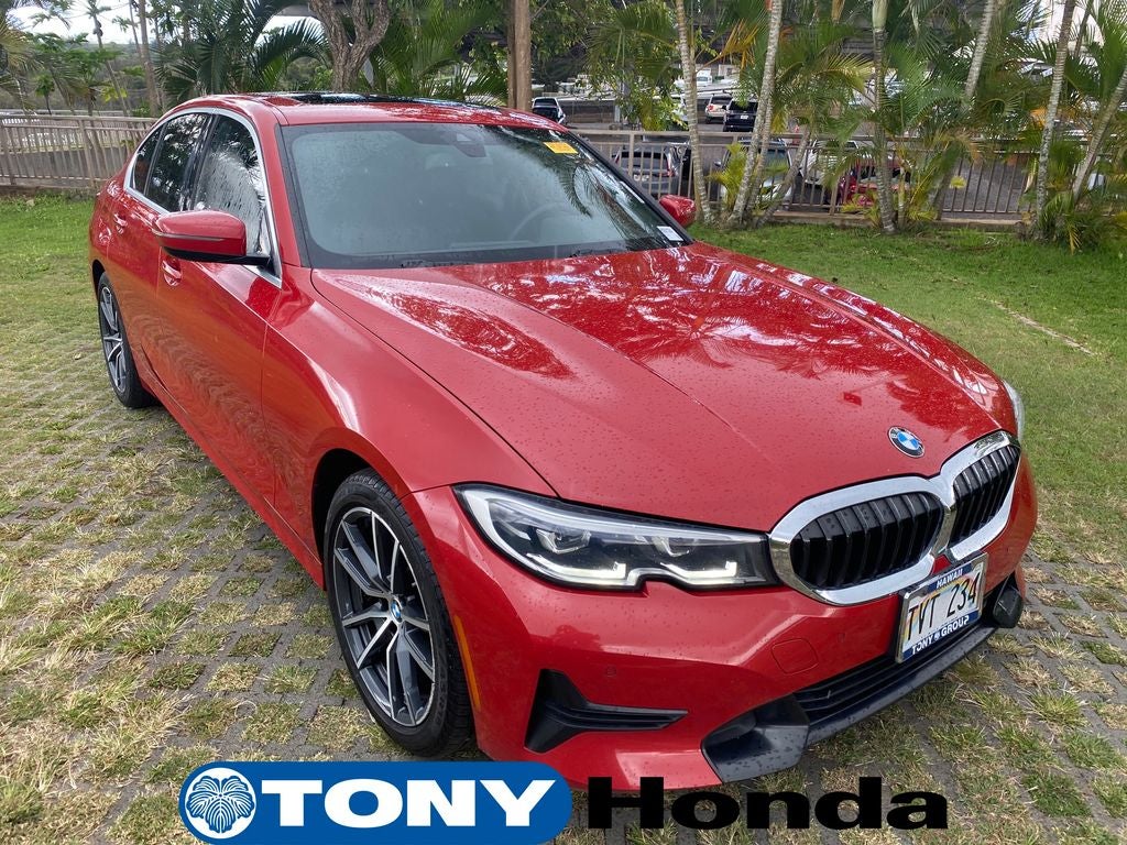 2019 BMW 3 Series 330i in Melbourne Red Metallic — front three-quarter view