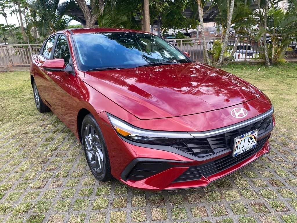 2024 Hyundai Elantra SEL in Ultimate Red — front three-quarter view